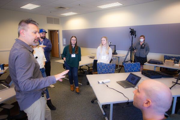 Instructor engaging with the group, sharing insights and experiences