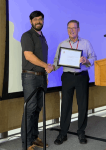 Image of Dan Winter being awarded