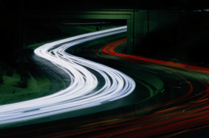 headlights in a time lapse image from above
